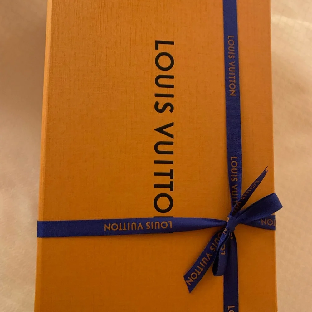 Brand new authentic smaller Luis Vuitton box with ribbon . Must have for closet!